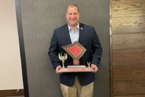 tom legath holds BCIAA trophy photo