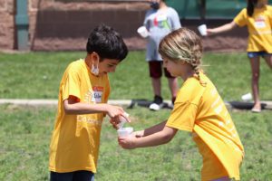kids playing at camp invention