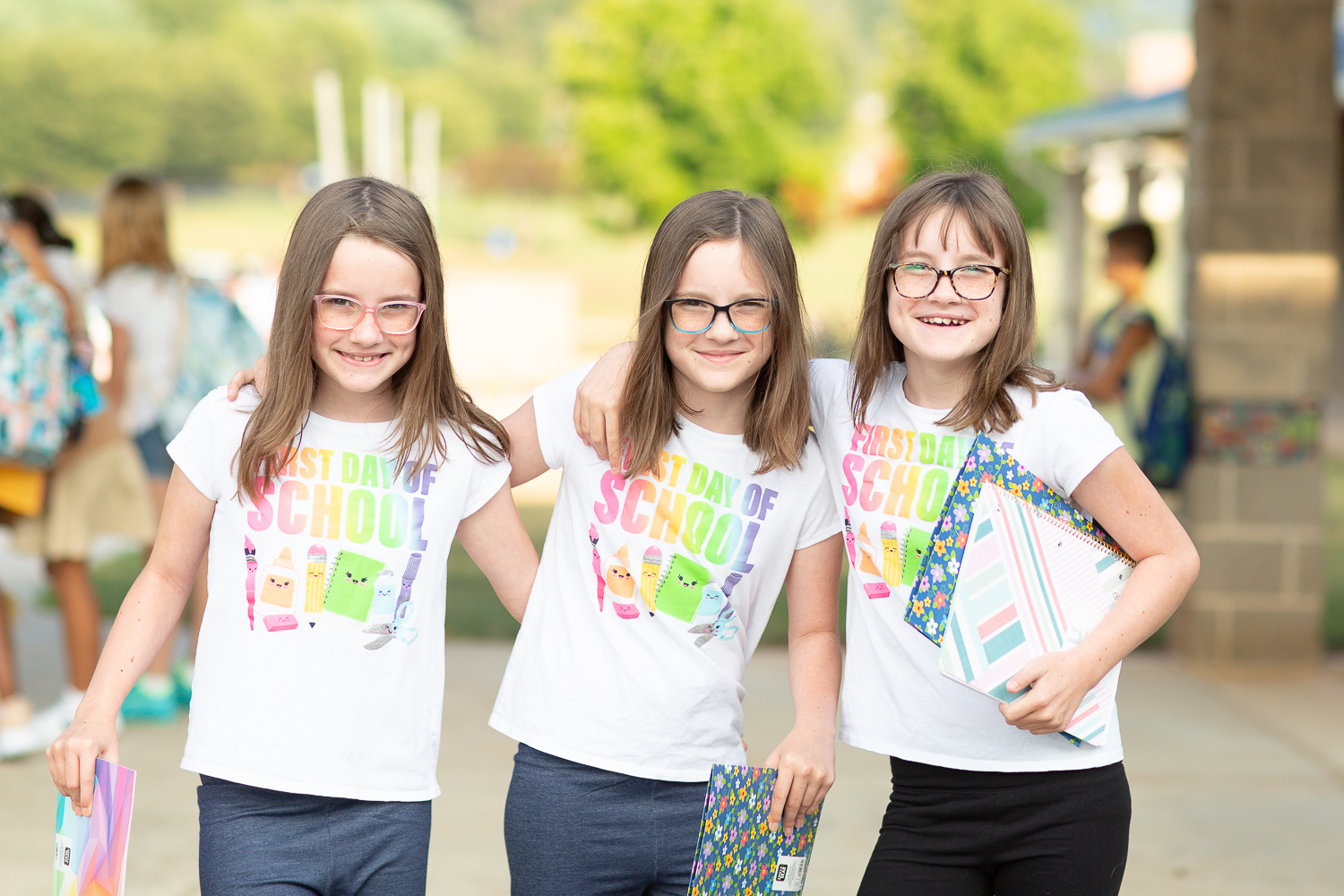 triplets wear first day of school shirt