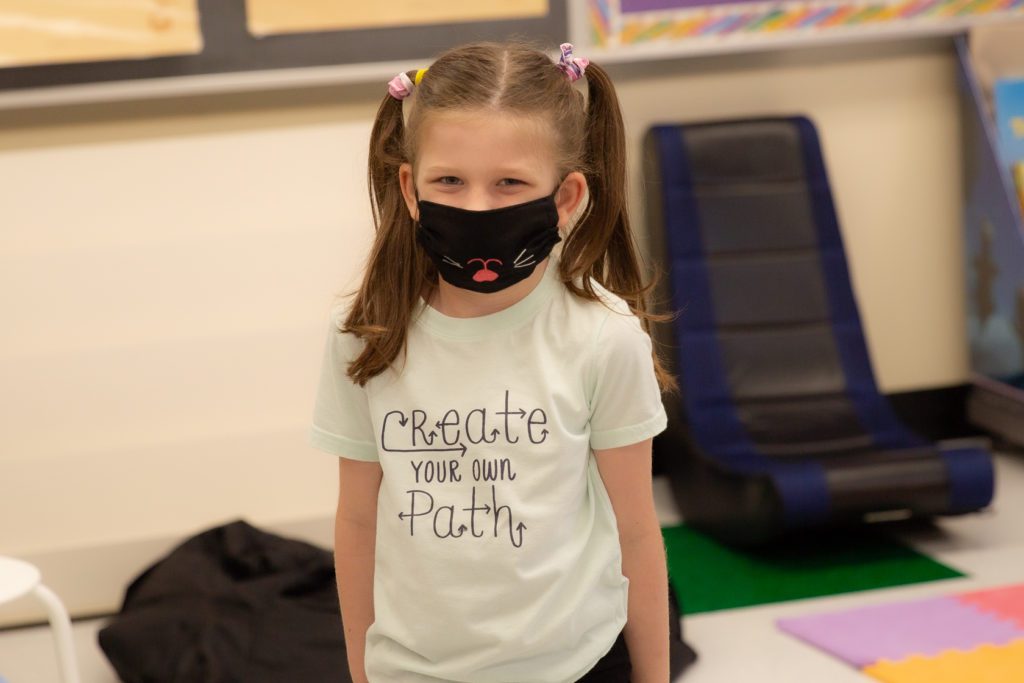 photo of student wearing inspirational shirt in mask