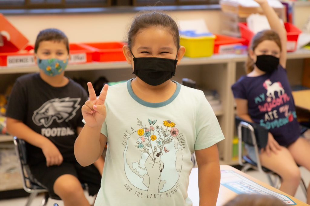 photo of student wearing inspirational shirt in mask