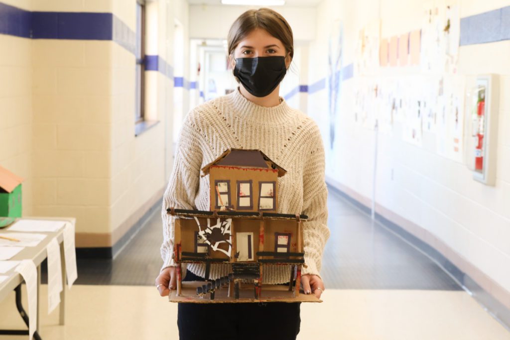 photo of students with handmade haunted houses