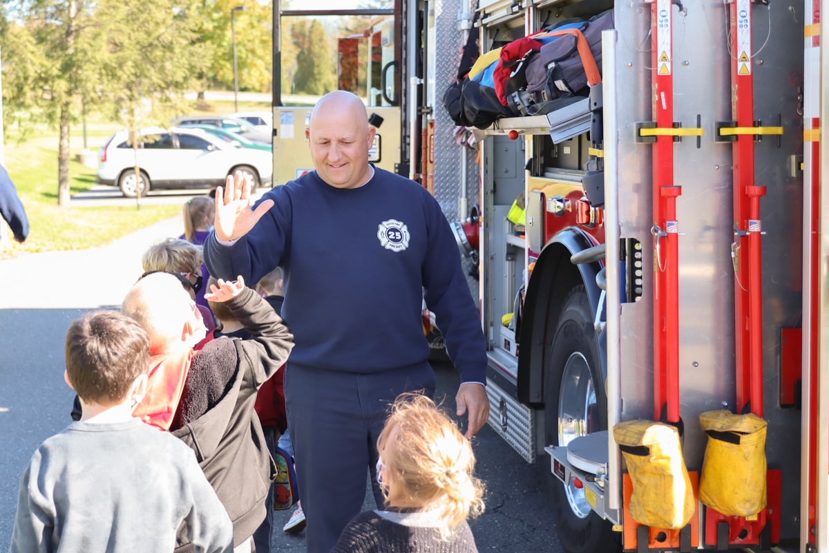 photo of exeter township firefighters and students