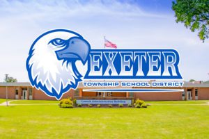 photo of administration building and exeter logo