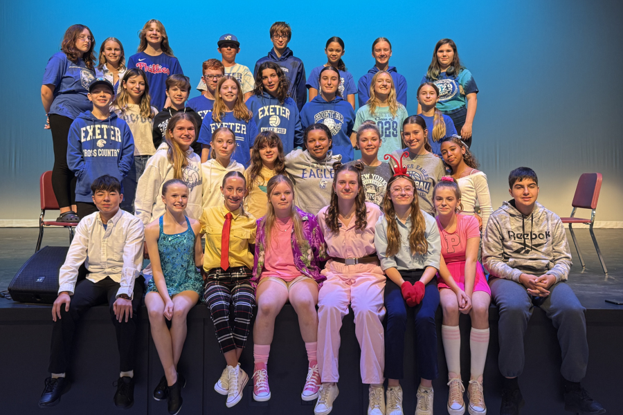 cast of spongebob musical gather on stage with blue background