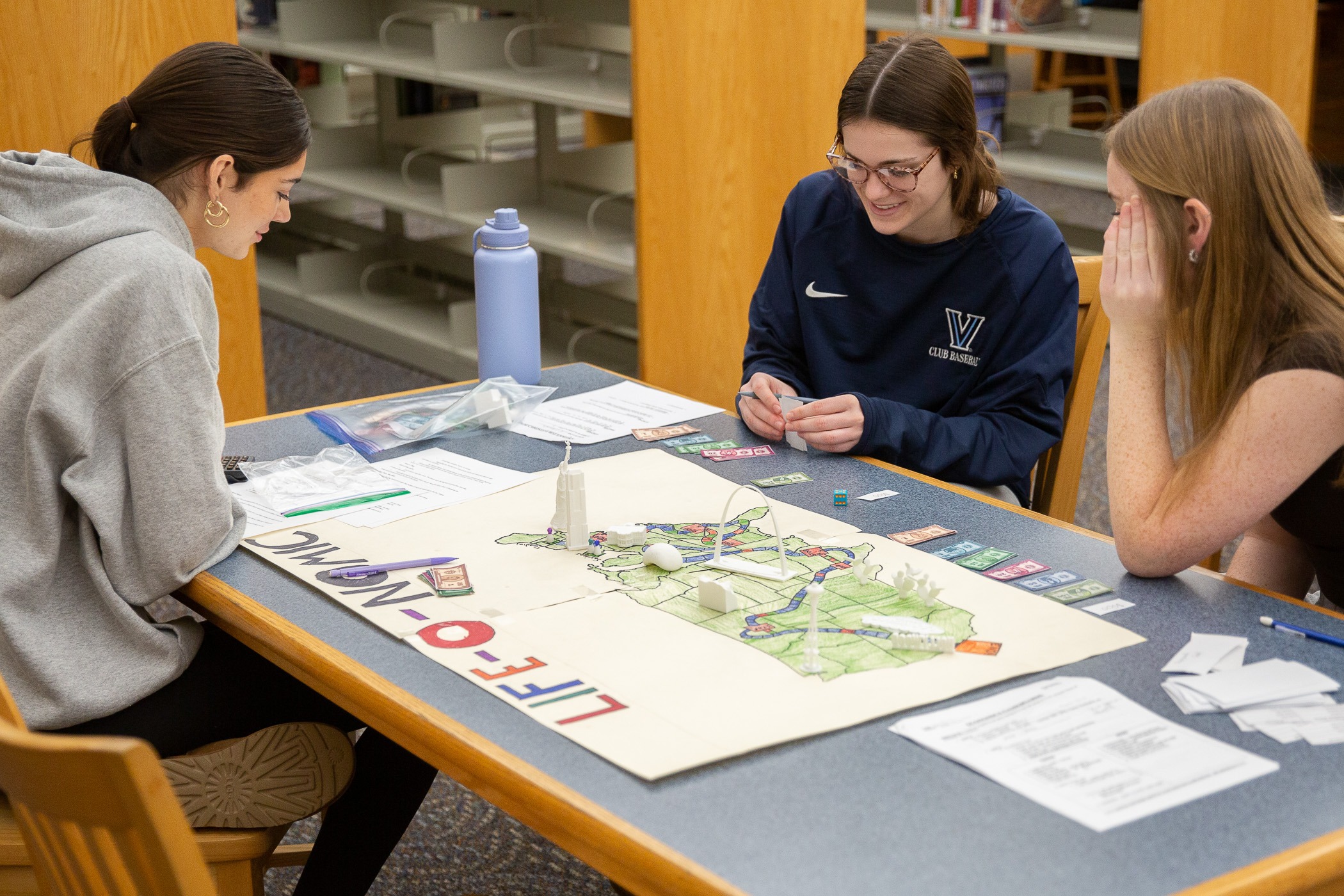 student play and discuss strategies over a board game