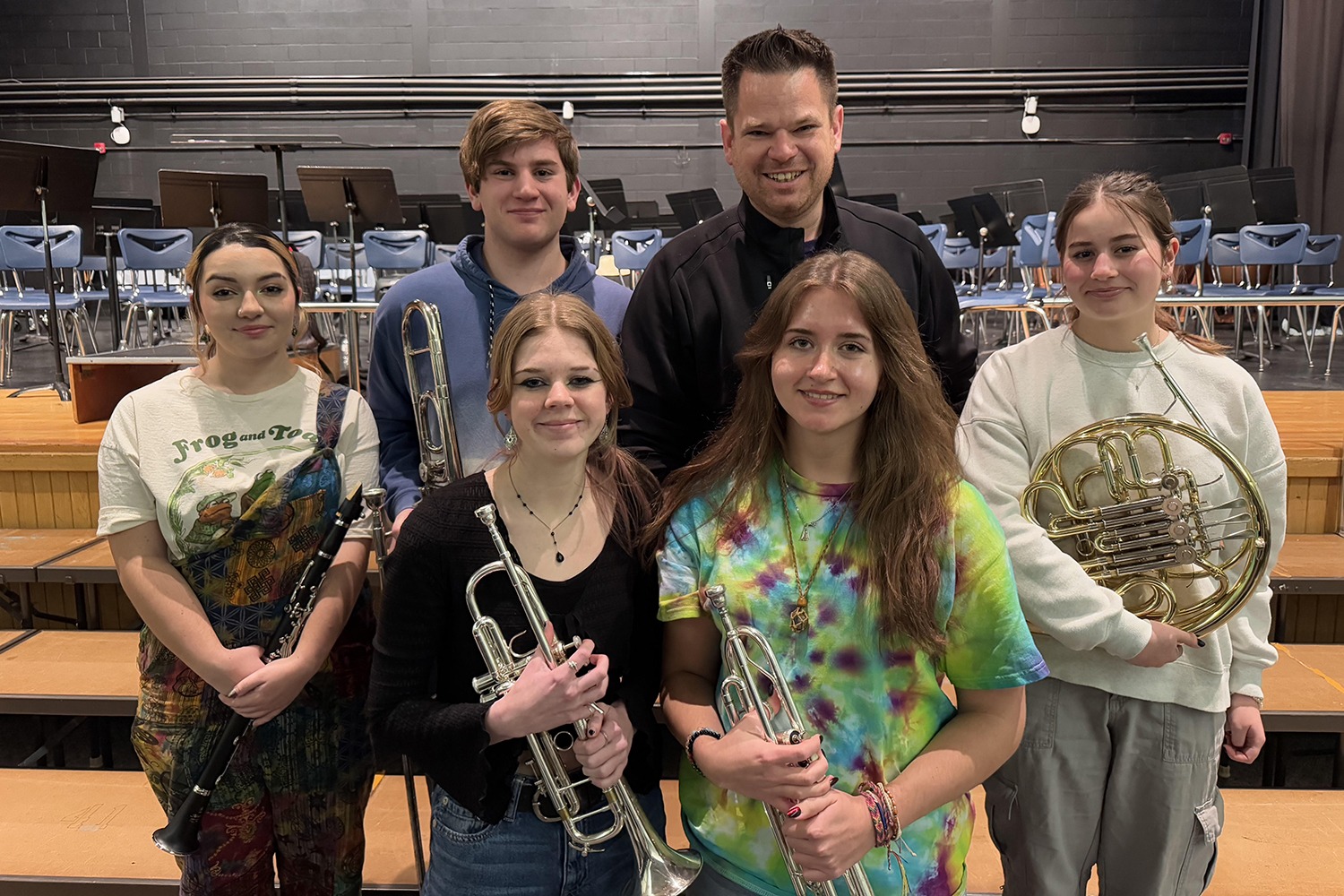 a small group of students hold instruments